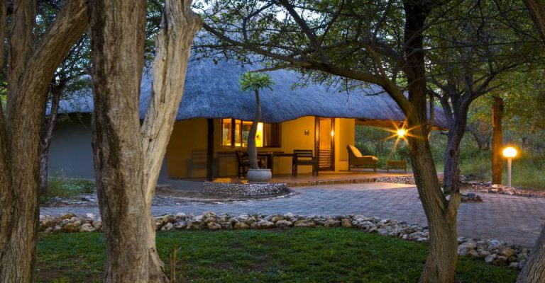 Thatched chalet exterior at Mushara Lodge