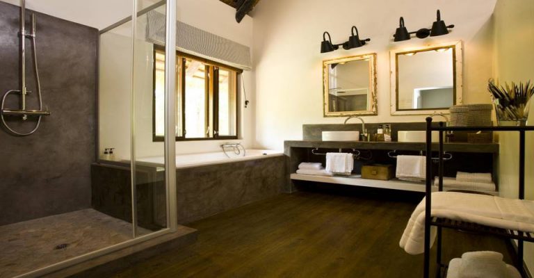 Shower and double vanity in a Mushara Lodge room
