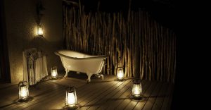 Lantern-lit outdoor bath at Onguma Bush Camp