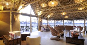Onguma Bush Camp lounge overlooking the family lodge waterhole