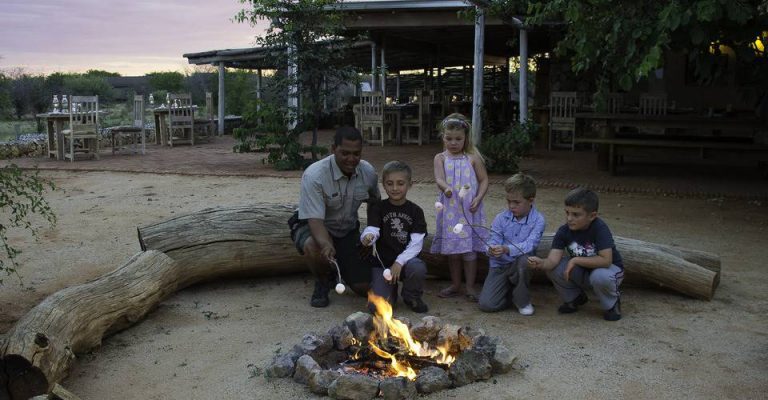 Children toasting marshmallows at Anderssons Camp