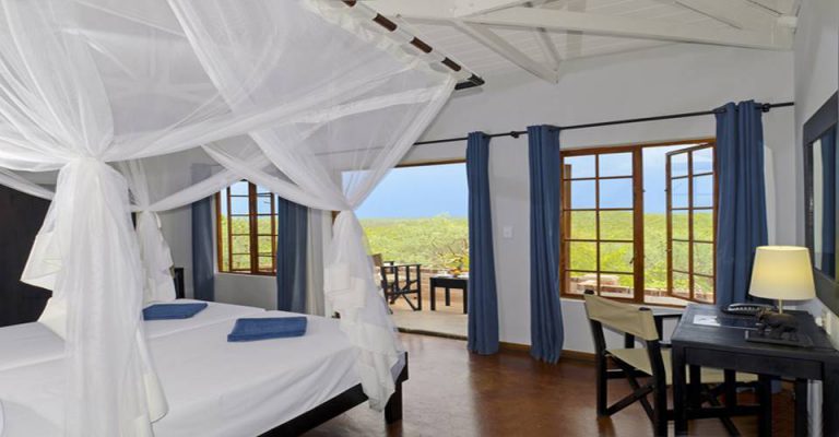 Air-conditioned room with private veranda at Etosha Safari Lodge