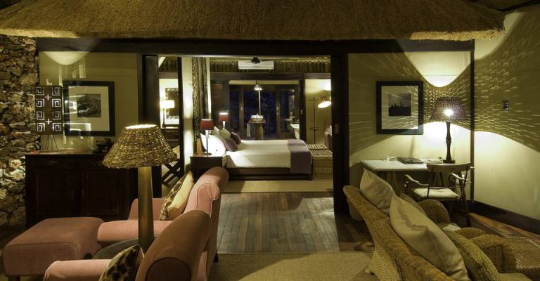 Private lounge and bedroom inside a Little Ongava villa