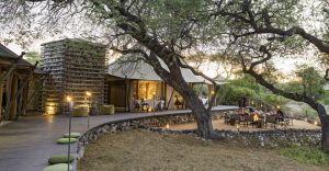 tented accommodation near Etosha – main lodge and fire pit beneath trees