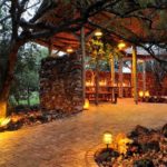 Lantern-lit restaurant walkway at Etosha Village