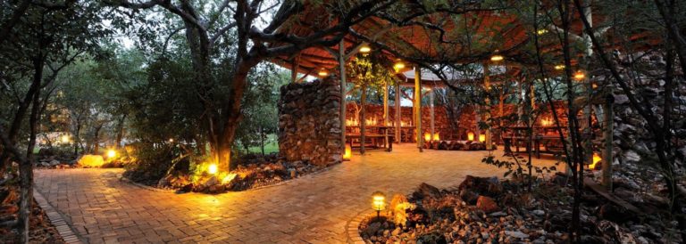 Lantern-lit restaurant walkway at Etosha Village