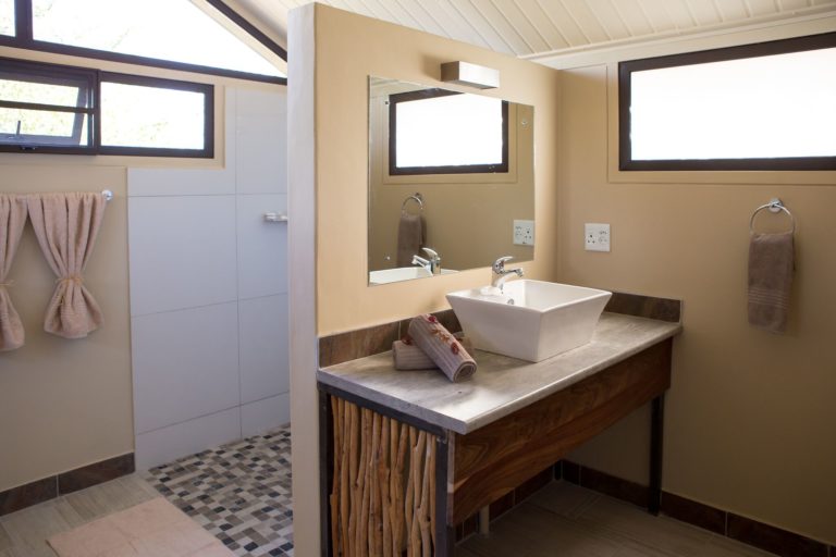 Modern en-suite shower bathroom at Etosha Village