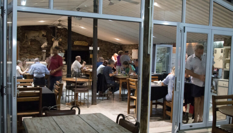 Etosha farm accommodation – guests dining in the farm restaurant