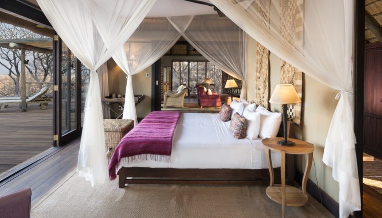 Little Ongava villa bedroom with panoramic reserve view