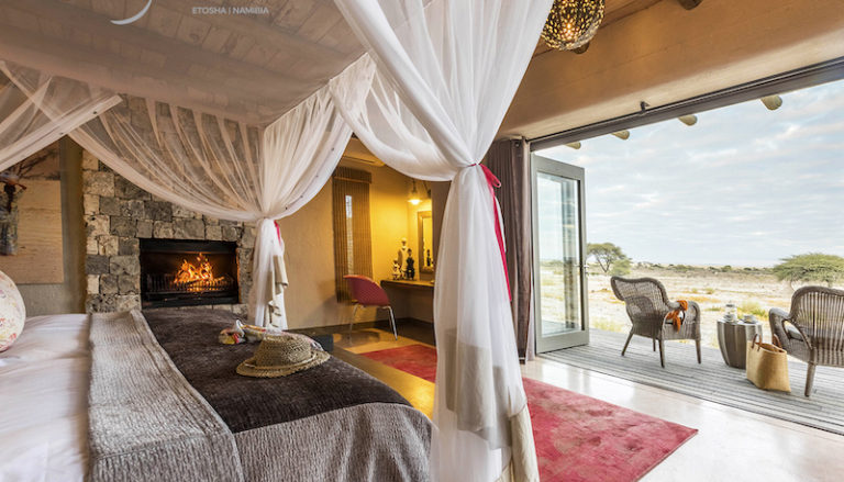 Bush Suite bedroom and deck at Onguma The Fort