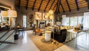 Private villa lounge with fireplace at Villa Mushara