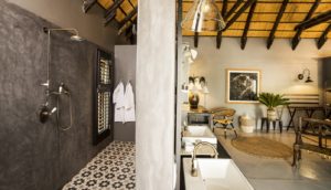 Walk-in shower and bathtub in Mushara Villa