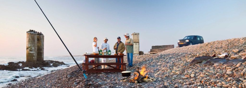 Terrace Bay Resort – anglers beside a historic coastal structure