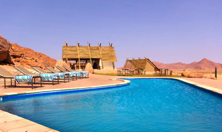 Desert Quiver Camp – swimming pool beneath granite outcrops