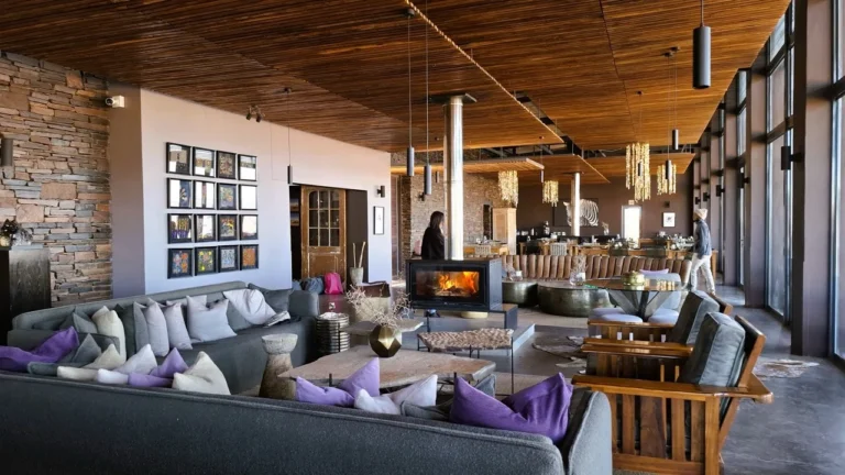 Lounge seating and dining area inside Fish River Lodge