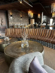 Curved lounge seating and stone tables at Fish River Lodge
