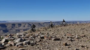 Cyclists on a rocky trail above Fish River Canyon