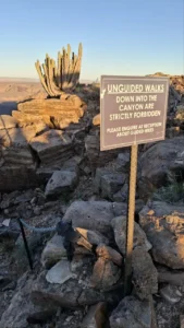 Canyon-rim sign and quiver tree near Fish River Lodge