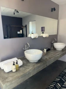 Twin bathroom basins and mirror at Fish River Lodge