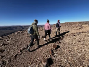 Guests hiking on a rocky canyon trail