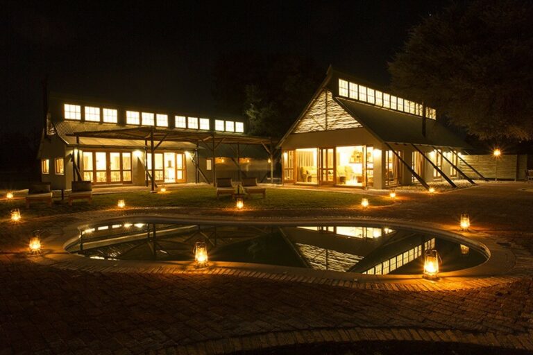 Kalahari Game Lodge – main lodge and swimming pool illuminated at night
