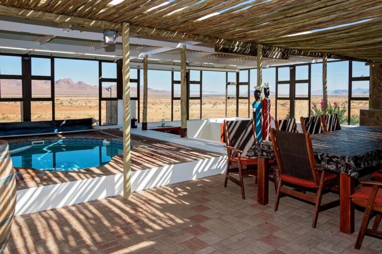 C27 lodge Namibia – covered pool and dining area at the villa