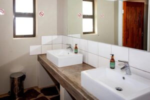 At Kronenhof Lodge – bright communal campsite bathroom