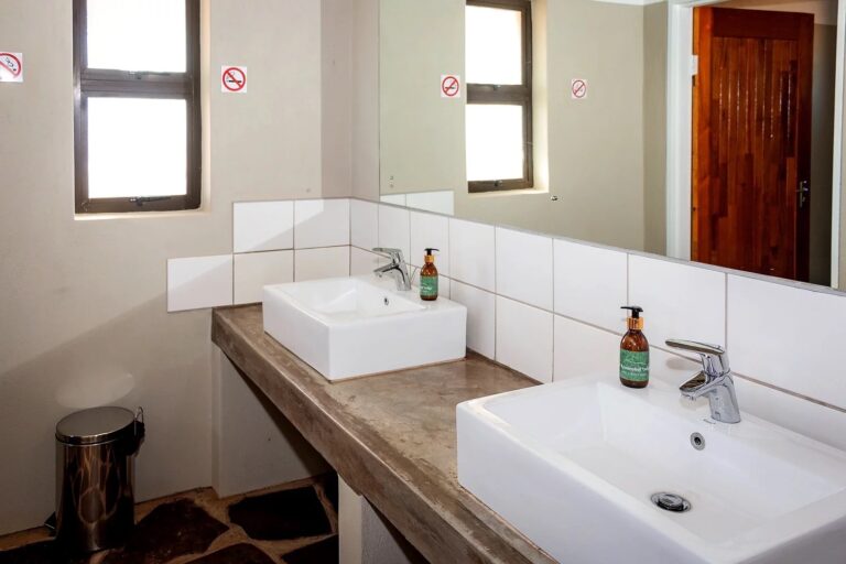 At Kronenhof Lodge – bright communal campsite bathroom