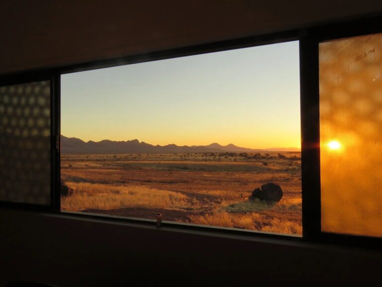 At Kronenhof Lodge – sunset seen through a guest-room window