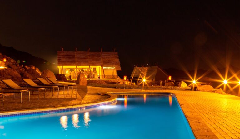 Desert Quiver accommodation – swimming pool illuminated at night