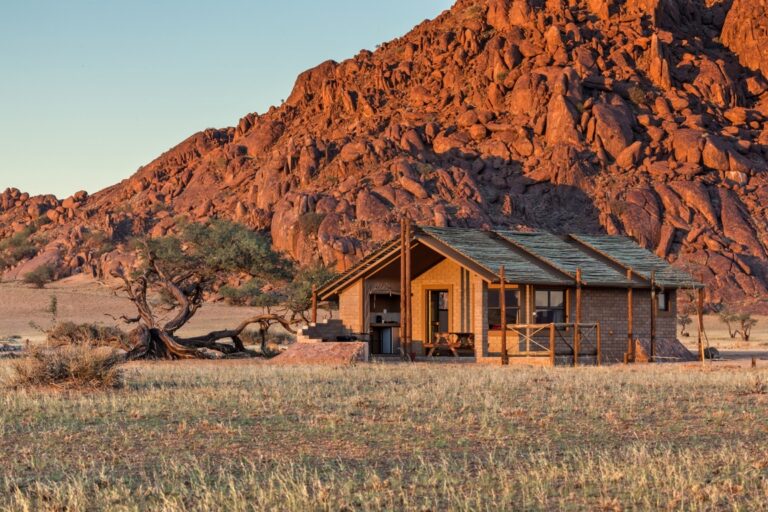 Taleni Desert Camp – chalet exterior among granite scenery