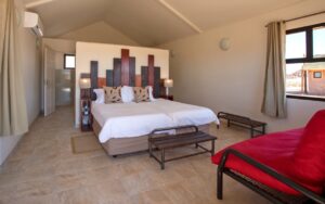 Sesriem desert camp – spacious chalet bedroom and sleeper couch