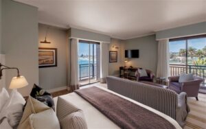 Strand Hotel accommodation – luxury suite bedroom and sitting room