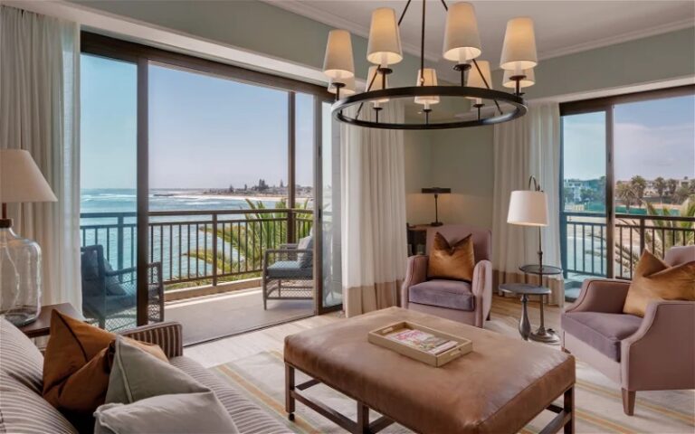 hotel on the Mole Swakopmund – suite lounge opening to a sea-view balcony