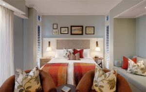 hotel on the Mole Swakopmund – luxury bedroom with lounge chairs