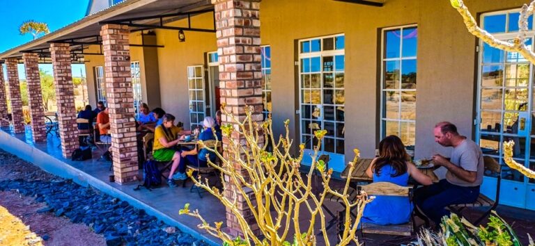 Lithops lodge Namibia – guests relaxing on the shaded lodge veranda