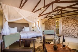 Bagatelle Kalahari Game Ranch – canopy bed in a Kalahari chalet