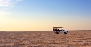Bagatelle Kalahari – game-viewing vehicle on open pan