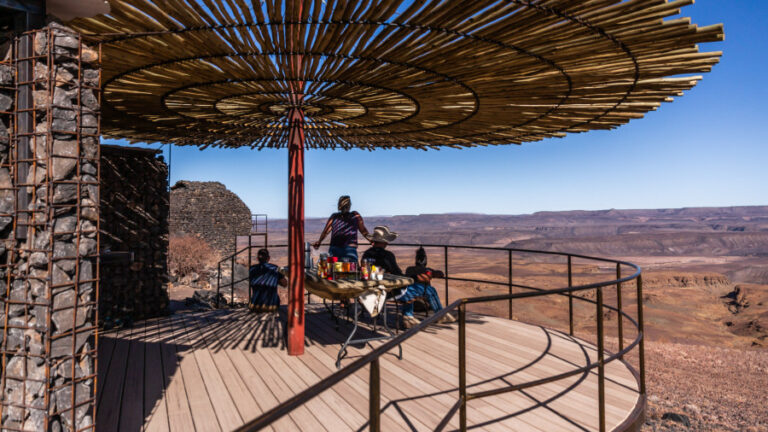 Fish River Canyon lodge – canyon-view deck with guests