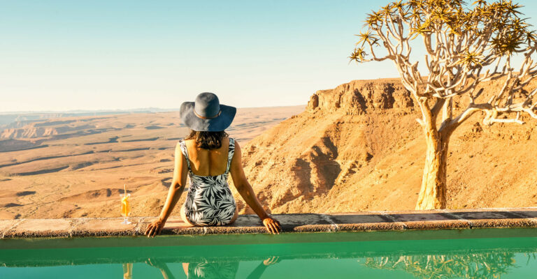 Fish River Lodge – guest relaxing beside the rim pool