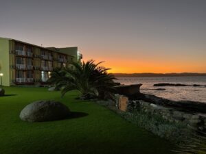 Luderitz Nest Hotel – hotel lawns at Atlantic sunset