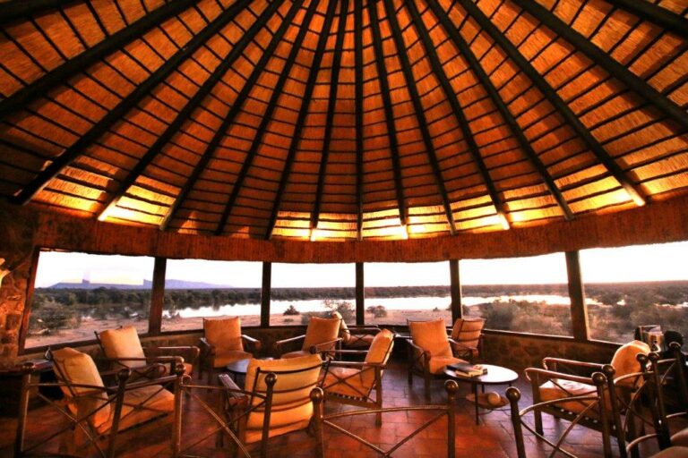 Mount Etjo accommodation – thatched common lounge with panoramic windows
