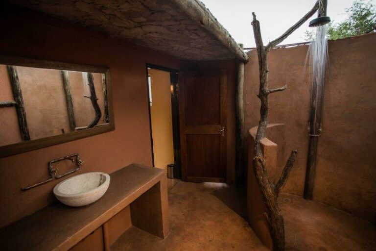 Okonjati Game Reserve lodge – rustic private campsite bathroom