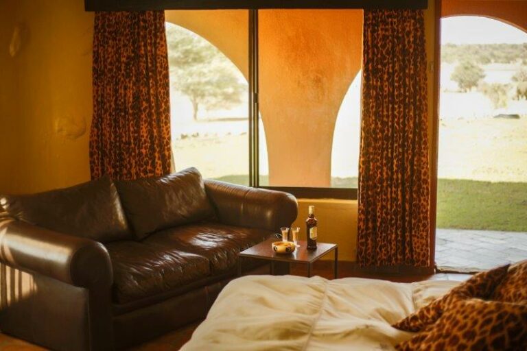 Okonjati Game Reserve lodge – suite seating area overlooking the garden