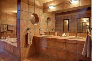 Okonjati Game Reserve lodge – double vanity in a luxury suite bathroom