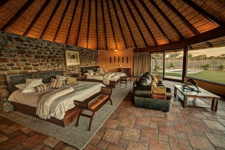 Mount Etjo Safari Lodge – villa bedroom and lounge with water views
