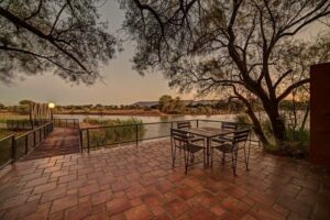 Mount Etjo Safari Lodge – outdoor seating under a broad shade tree