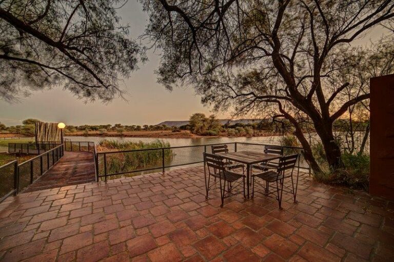 Mount Etjo Safari Lodge – outdoor seating under a broad shade tree