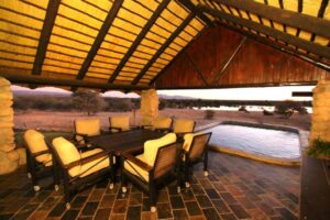 Okonjati Game Reserve lodge – open-sided lounge beside a plunge pool
