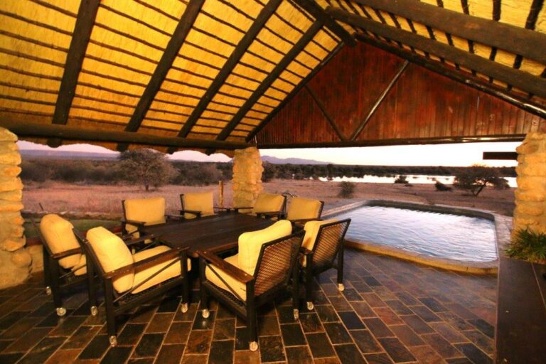 Okonjati Game Reserve lodge – open-sided lounge beside a plunge pool